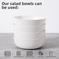 Four white speckled bowls stacked with oven safe, dishwasher safe, microwave safe, lead free and refrigerator safe icons below