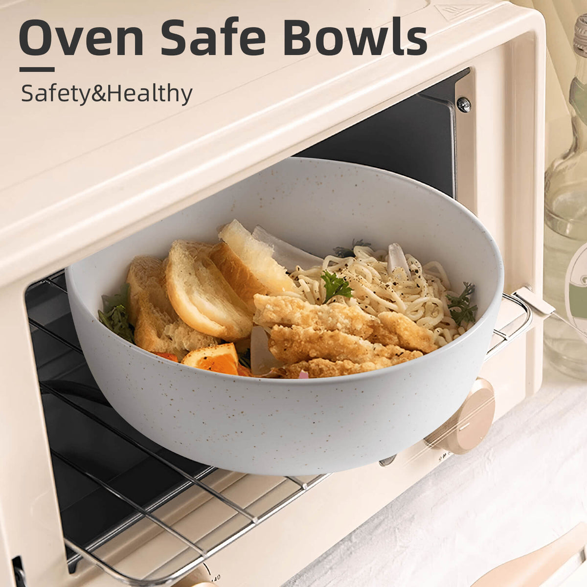 Light blue speckled ceramic bowl filled with noodles and fried food inside open cream toaster oven