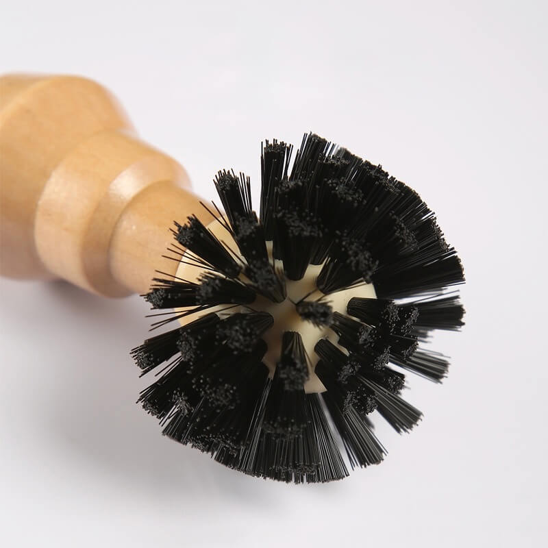Side view of coffee cleaning brush showing dense bristle head