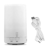 White mini cool mist humidifier and essential oil diffuser with USB cable on white background