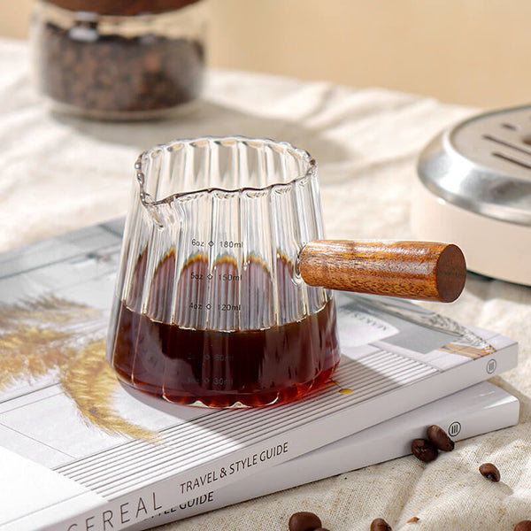 WEDAILY mini glass coffee cup with wooden handle in use pouring espresso