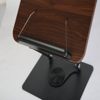 Close-up of dual paper clips and holding board edge on adjustable book stand