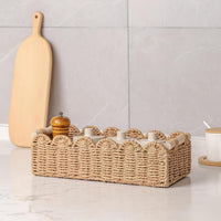 Khaki woven basket with spice jars styled on kitchen counter